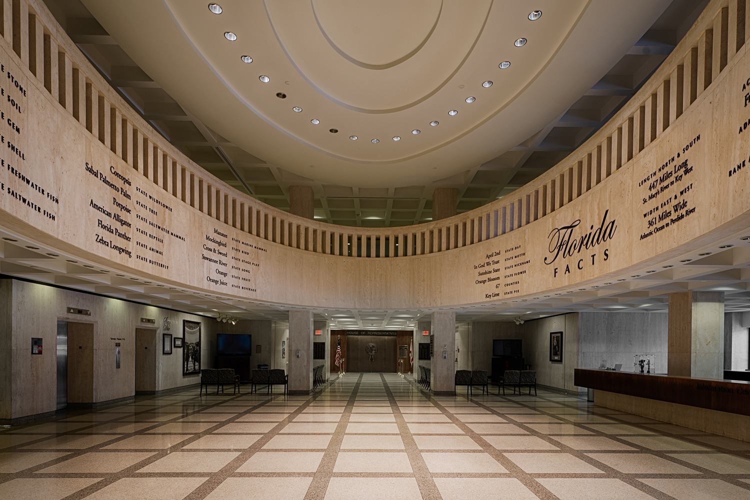 Spacious lobby with “Florida facts” engraved on the wall under a circular ceiling
